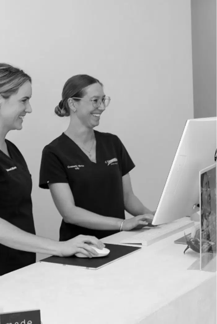 Wellness staff greeting clients at reception